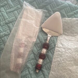 The Pampered Chef Red and Silver Cake Server